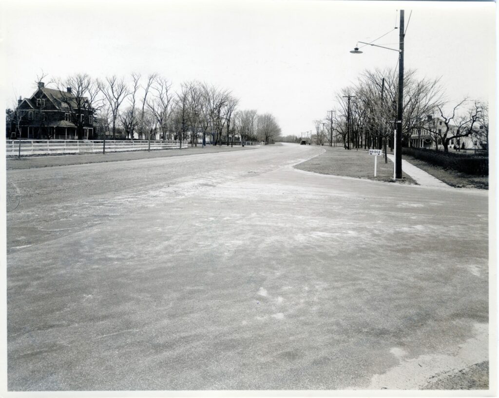 Quogue Street at Post Lane, looking east. Capt. Henry Gardiner house, ca. 1820, on right. “Bonnyfield,” ca. 1886, and “Zephyros,” ca. 1888, on left.