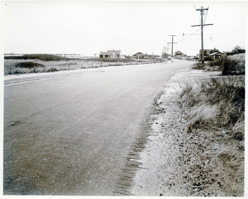 Dune Road, looking east. The new Post Lane bridge on left in the distance.