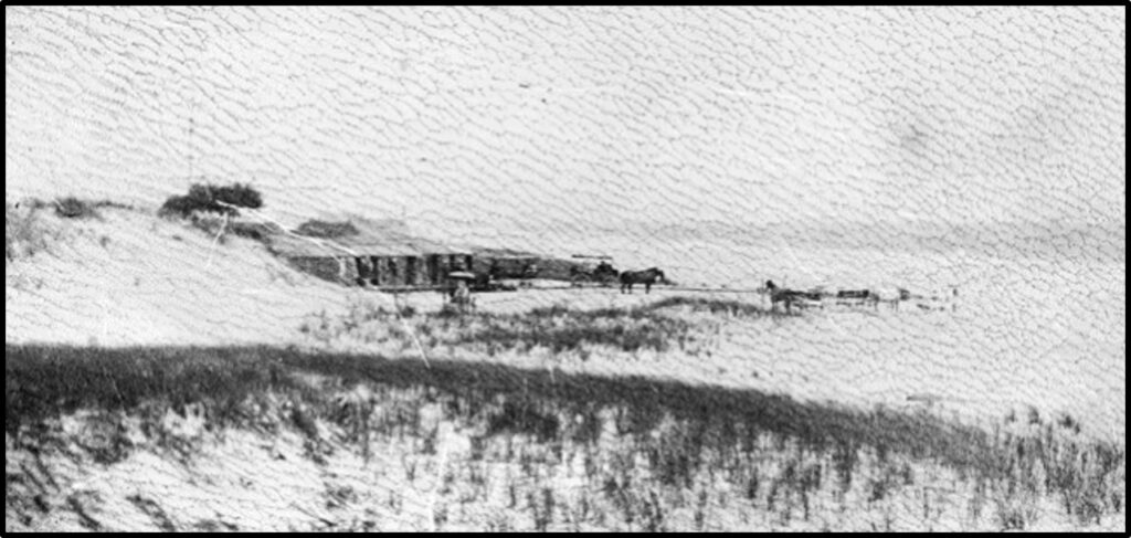 Detail of the Hallock’s Beach cabanas, with horse-drawn carriages unloading beachgoers.